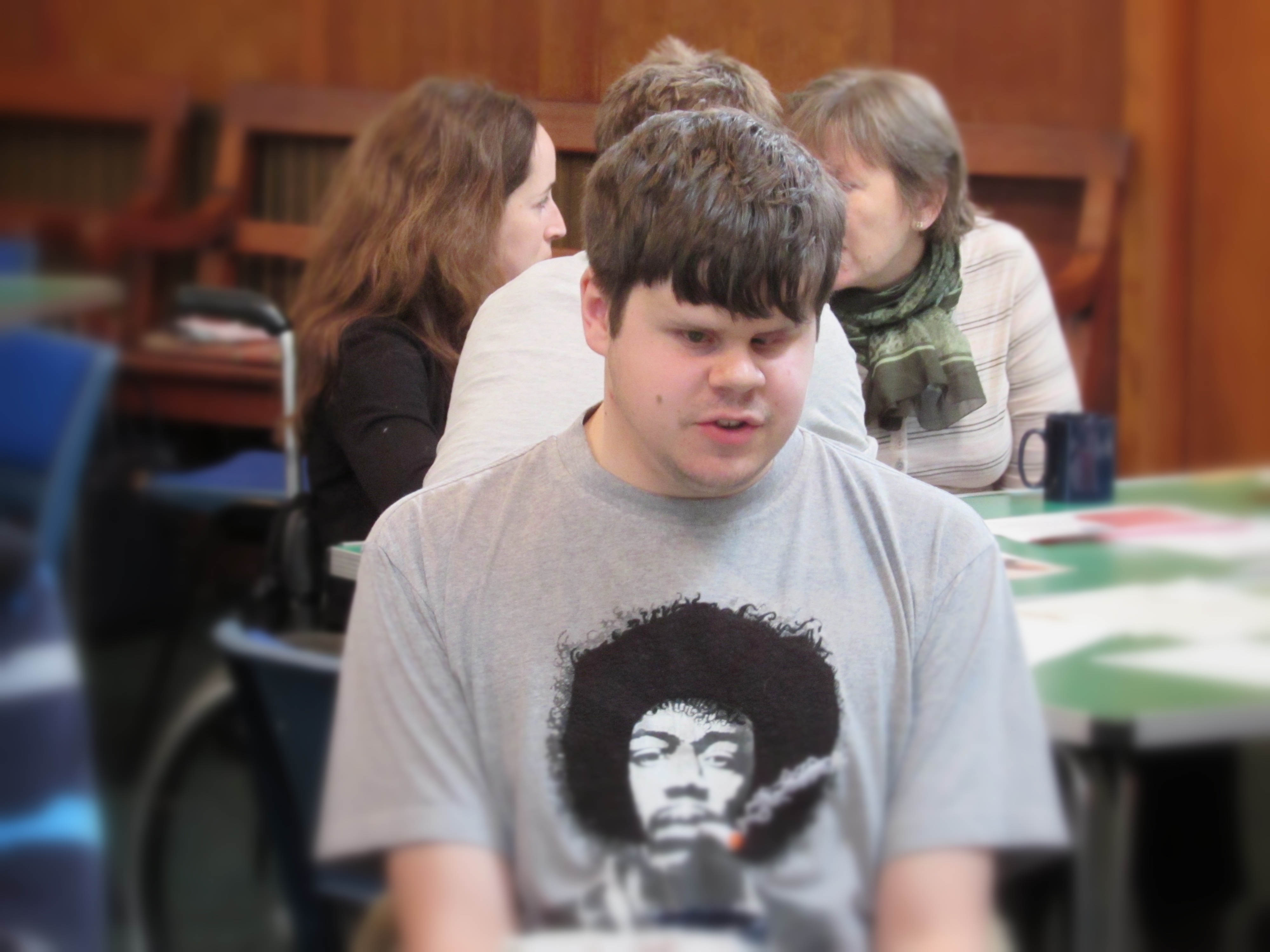Visually impaired man in a meeting