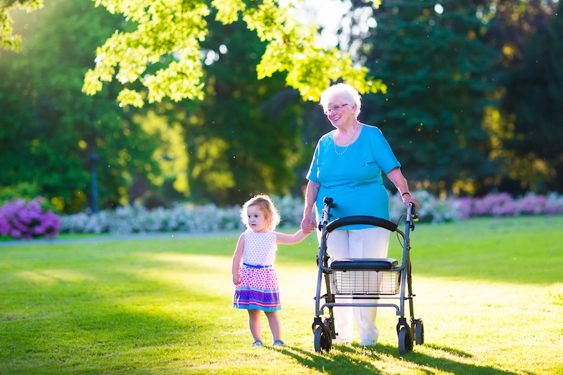 Older lady and small child walking hand in hand
