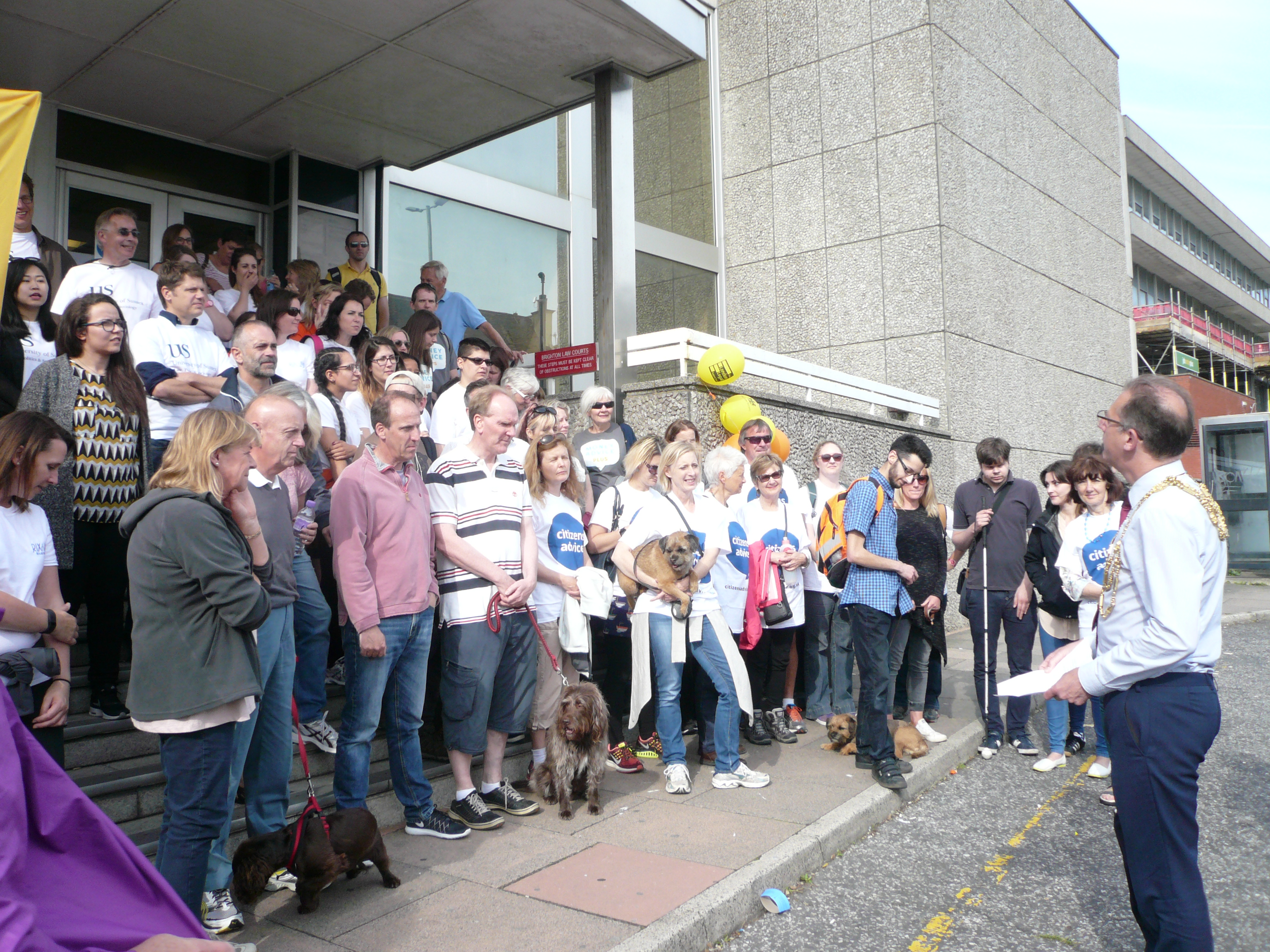 People gathered on steps before sponsored walk