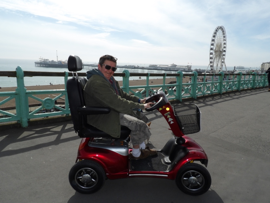 A person delivering a scooter in Brighton