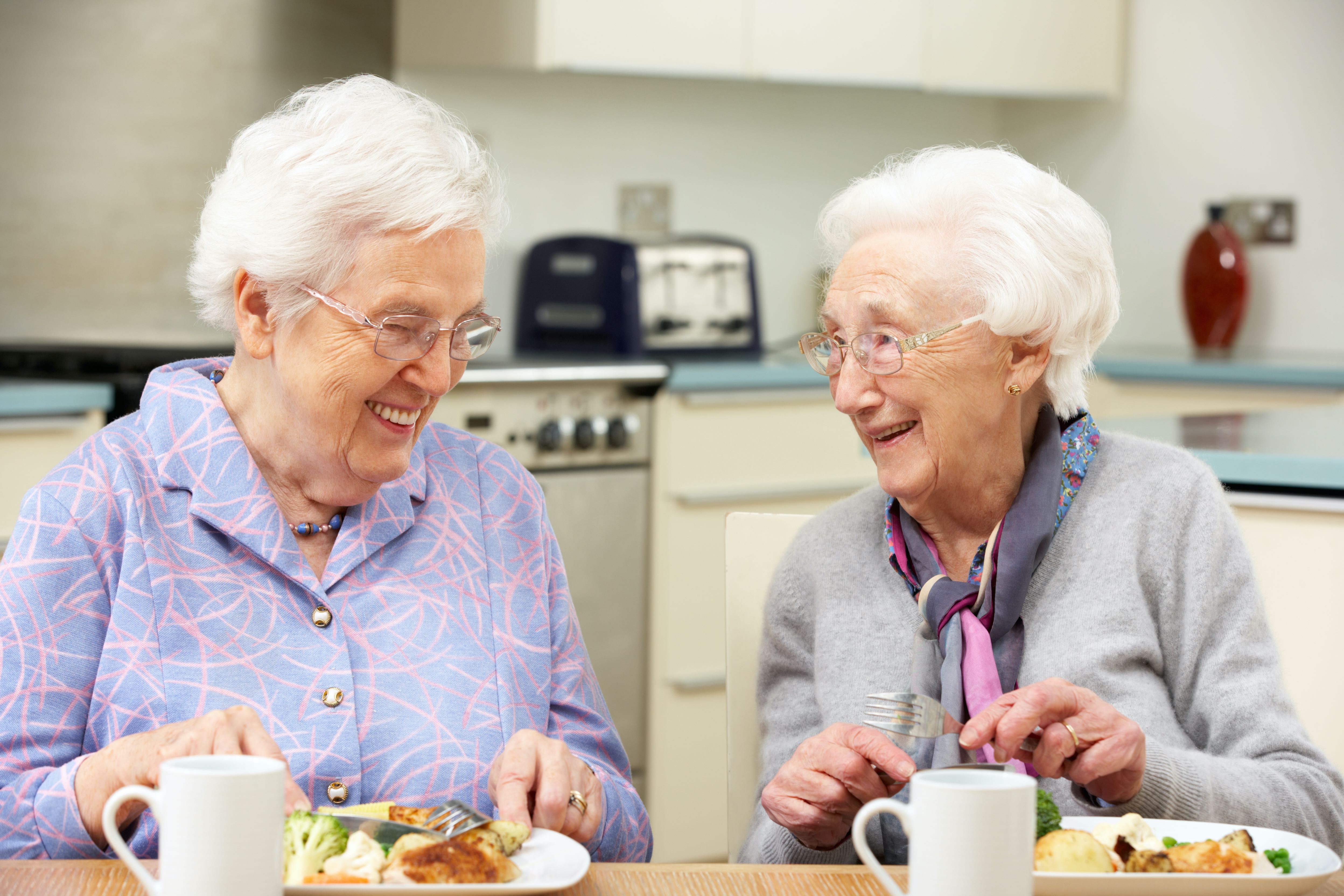 older women eating a meal together