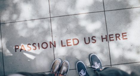 Photo of people's feet on tiled floor with caption Passion Led Us Here