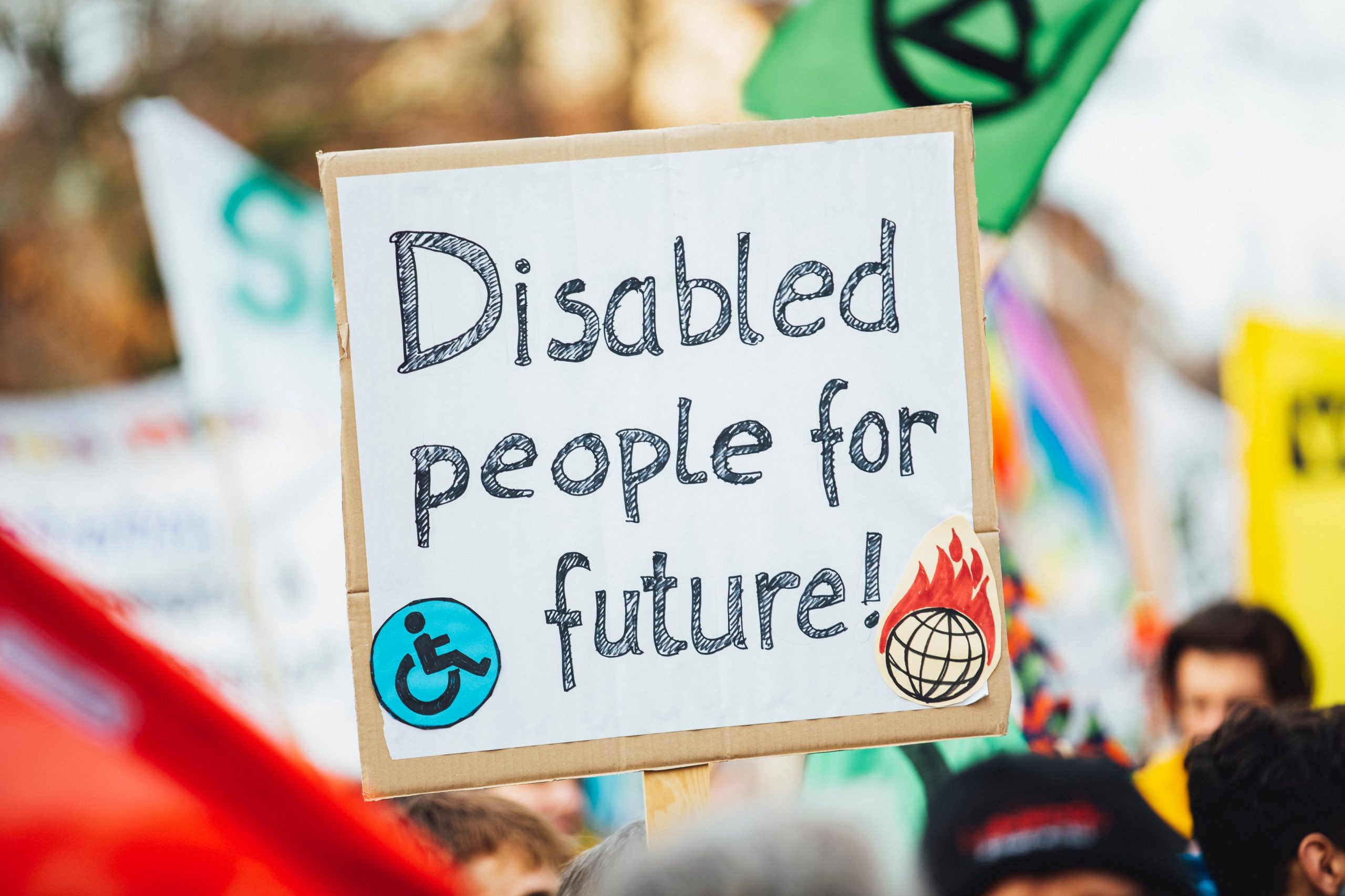 Sign which says Disabled People For Future, being held up