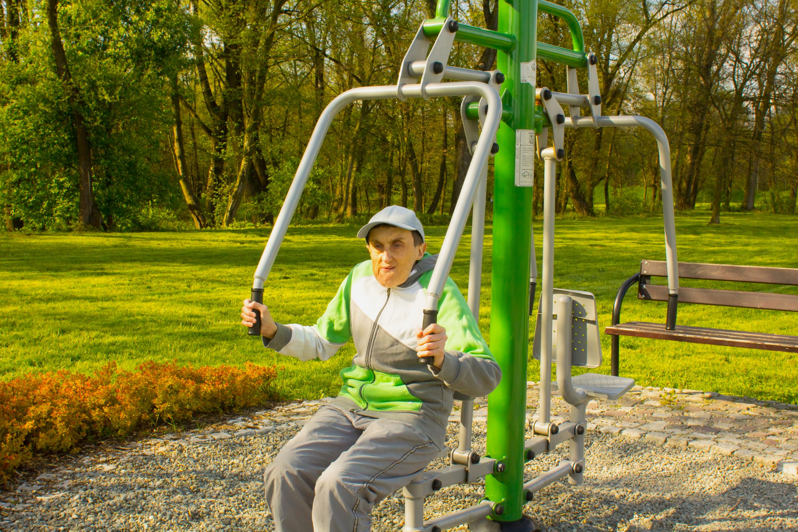 Photo of disabled man using outside gym